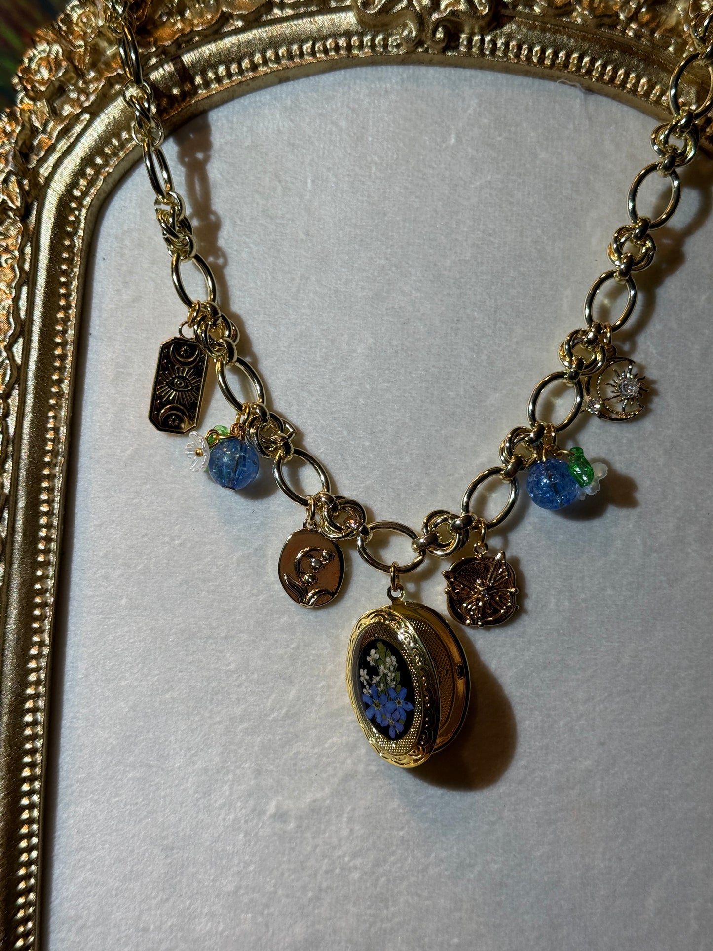Gold charm necklace (c)
