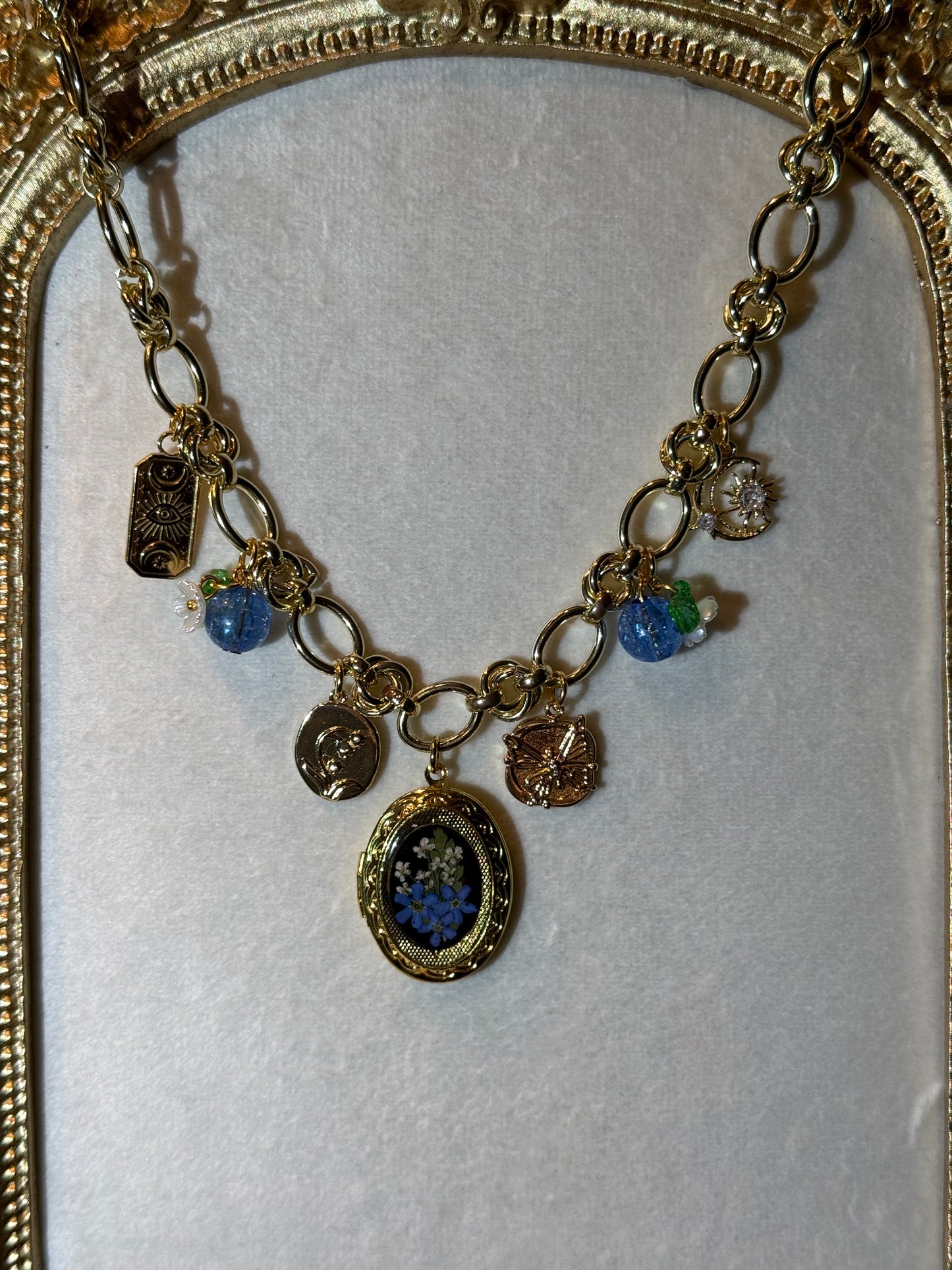 Gold charm necklace (c)