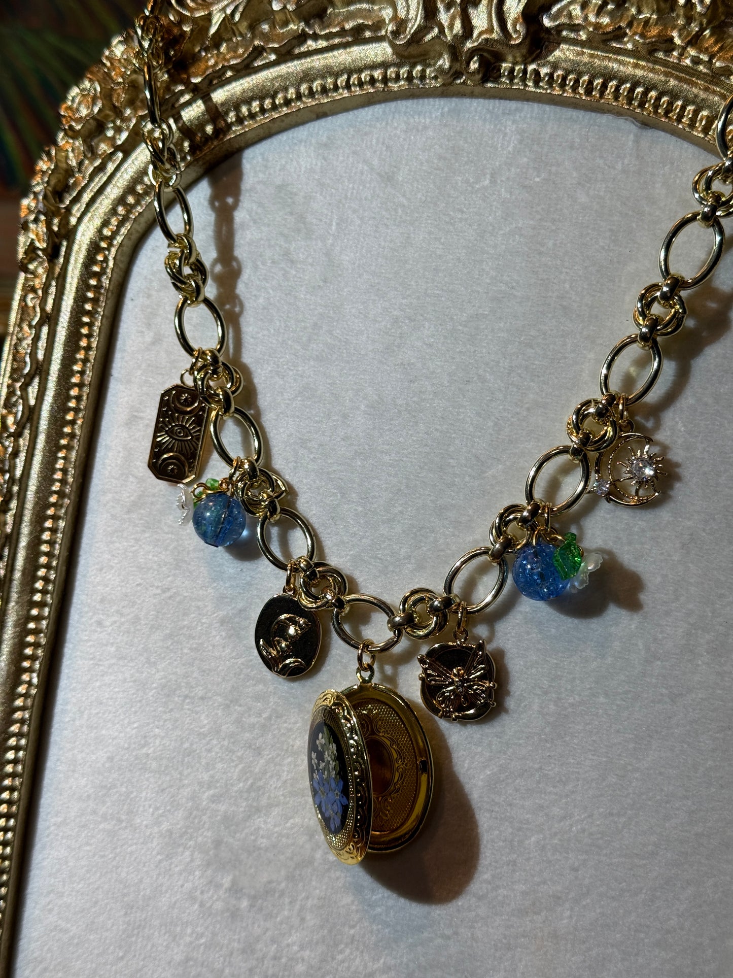 Gold charm necklace (c)