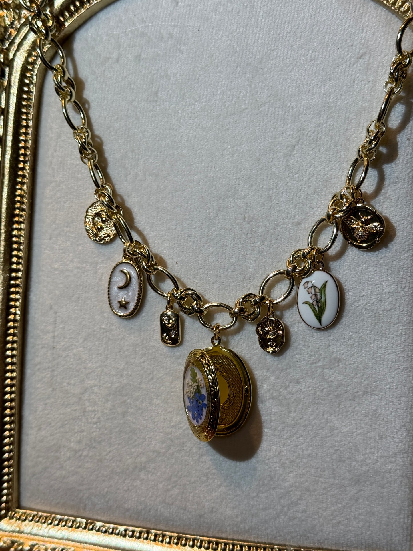 Gold locket charm necklace (a)